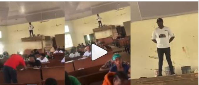 “Na to go submit” – Invigilator mounts very high table to monitor students writing exams (Watch)